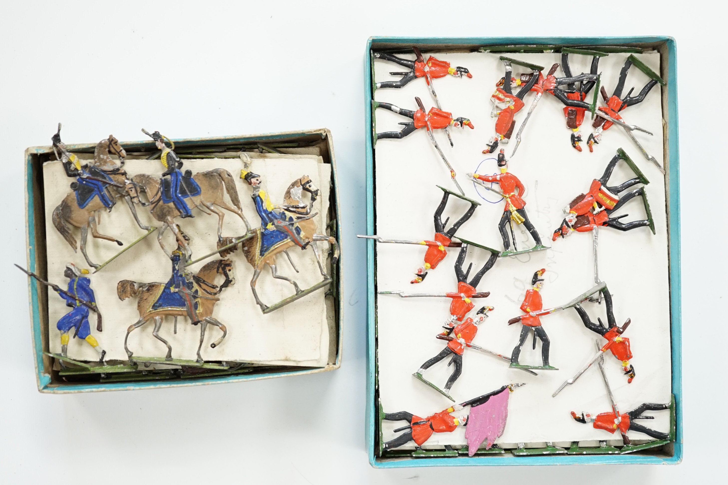 A collection of late nineteenth century flat/semi-flat soldiers by Heinrichsen, Nürnberg, etc. including some in original boxes, three examples with lids, including infantry, Highlanders, French infantry, cavalry, etc.